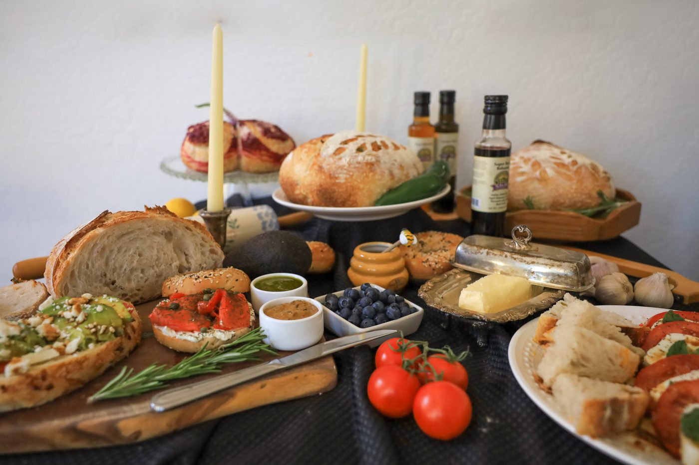 A full A Lovely Loaf spread — loaves, focaccia, toasts, and scones