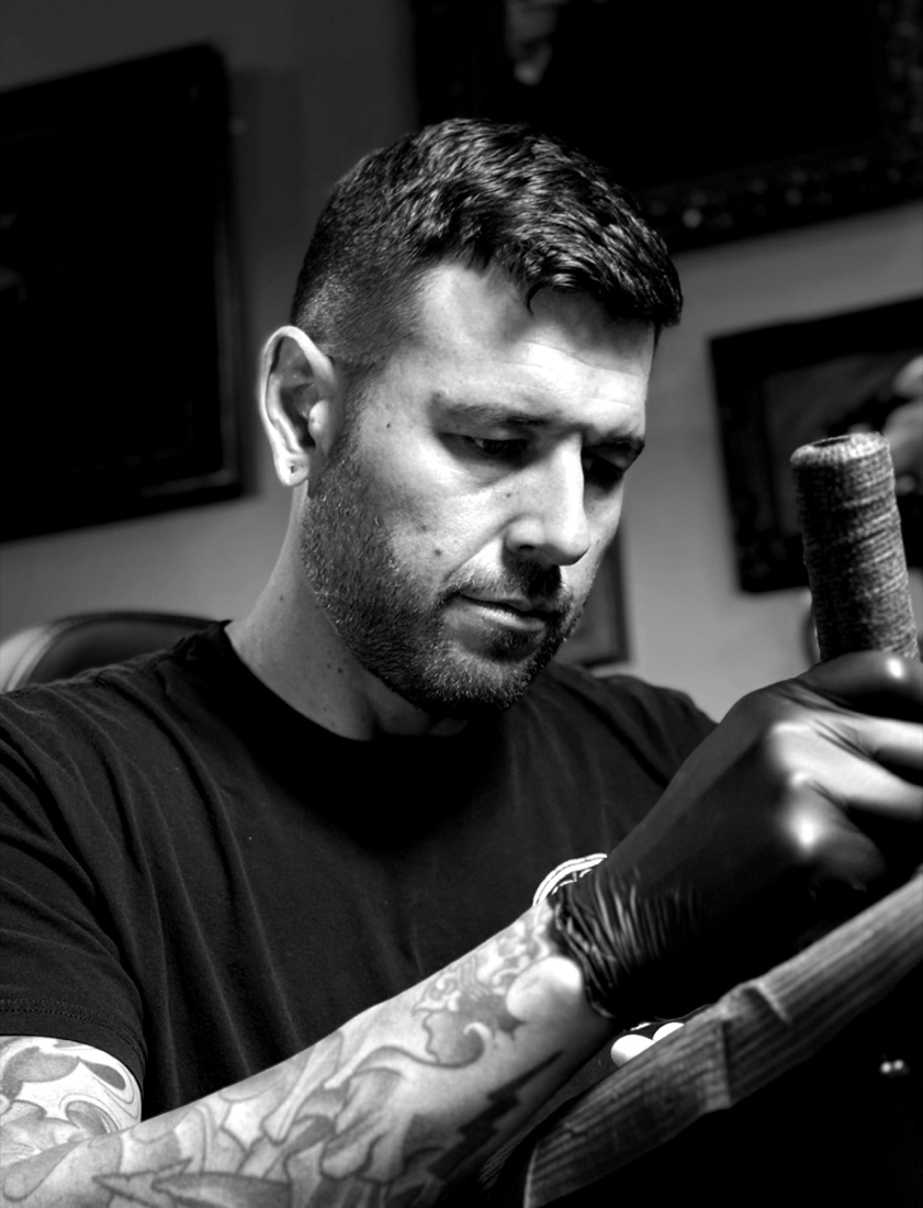 An artist at work at North Mountain Tattoo