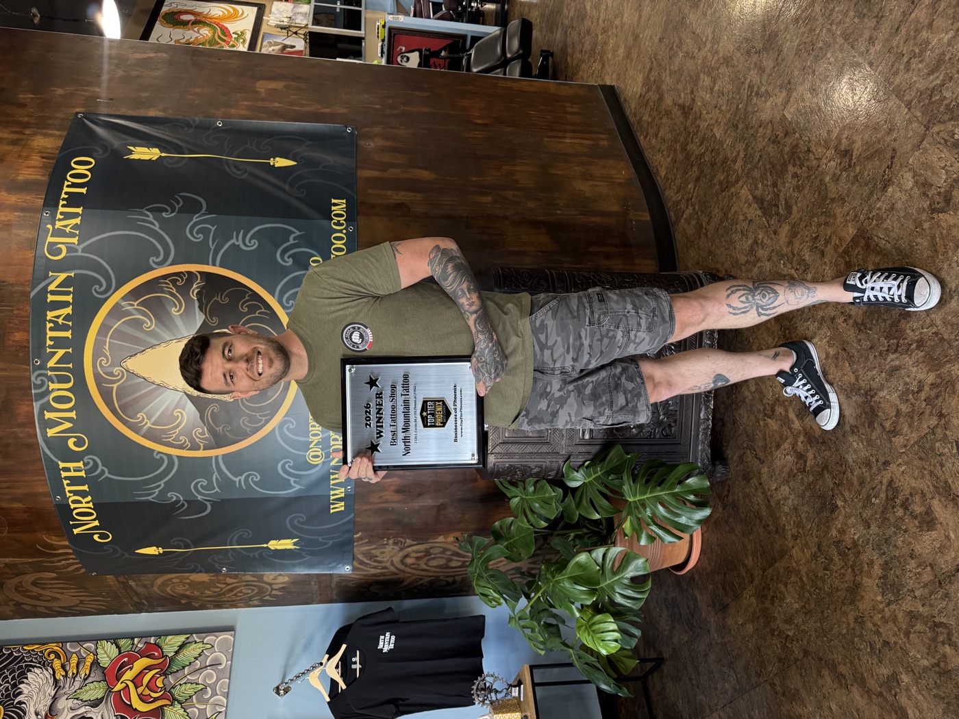 Dan Mattingly with the Top Tier Phoenix award at North Mountain Tattoo