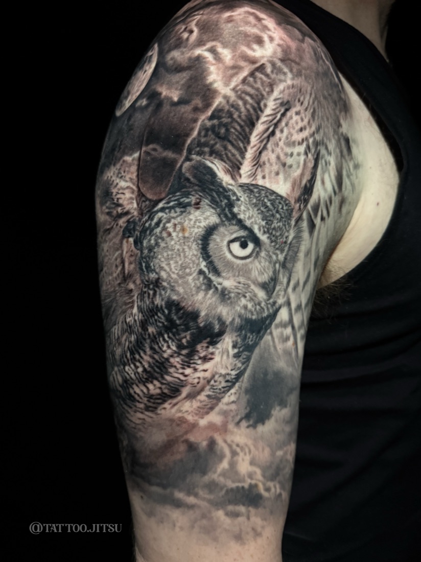 Great horned owl and moon tattoo in black and grey realism by Dan Mattingly